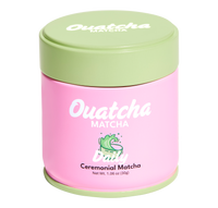 Pink Ouatcha Matcha Daily ceremonial matcha tin with a light green lid, labeled “Ouatcha Matcha – Daily – Ceremonial Matcha, Net Wt. 1.06 oz (30 g).
