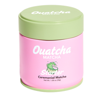 Pink Ouatcha Matcha Starter ceremonial matcha tin with a light green lid, labeled “Ouatcha Matcha – Reserve – Ceremonial Matcha, Net Wt. 1.06 oz (30 g).