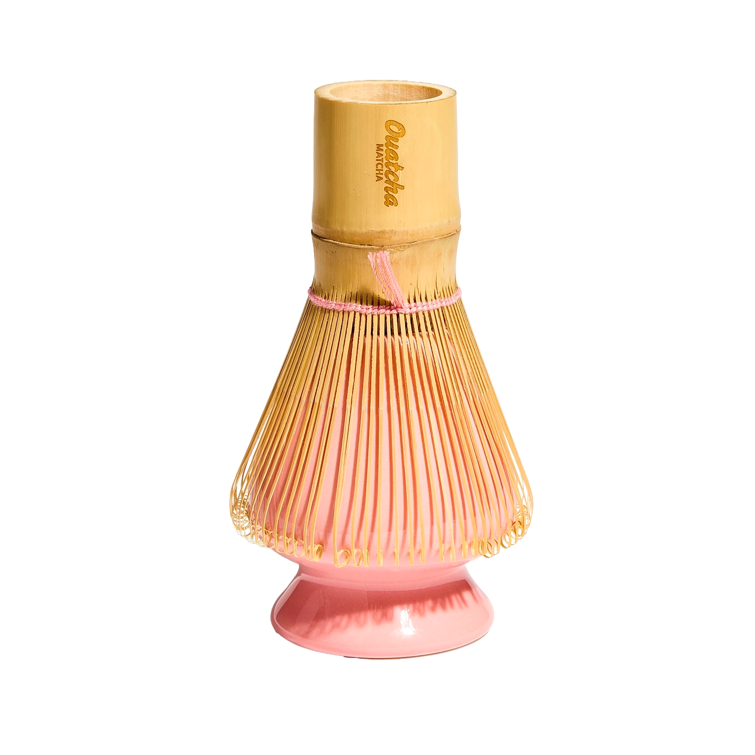 Ouatcha Matcha bamboo whisk holder with pink whisk holder on a white background