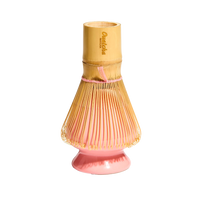 Ouatcha Matcha bamboo whisk holder with pink whisk holder on a white background