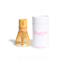 Bamboo whisk and its packaging with 'Ouatcha' branding on a white background